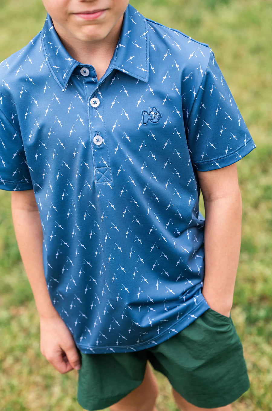 BOY'S SHORT SLEEVE PRO PERFORMANCE POLO IN FISHING ROD PRINT ON BLUE