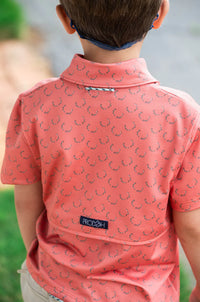 BOY'S SHORT SLEEVE PRO PERFORMANCE POLO IN DEER ANTLER PRINT ON ORANGE