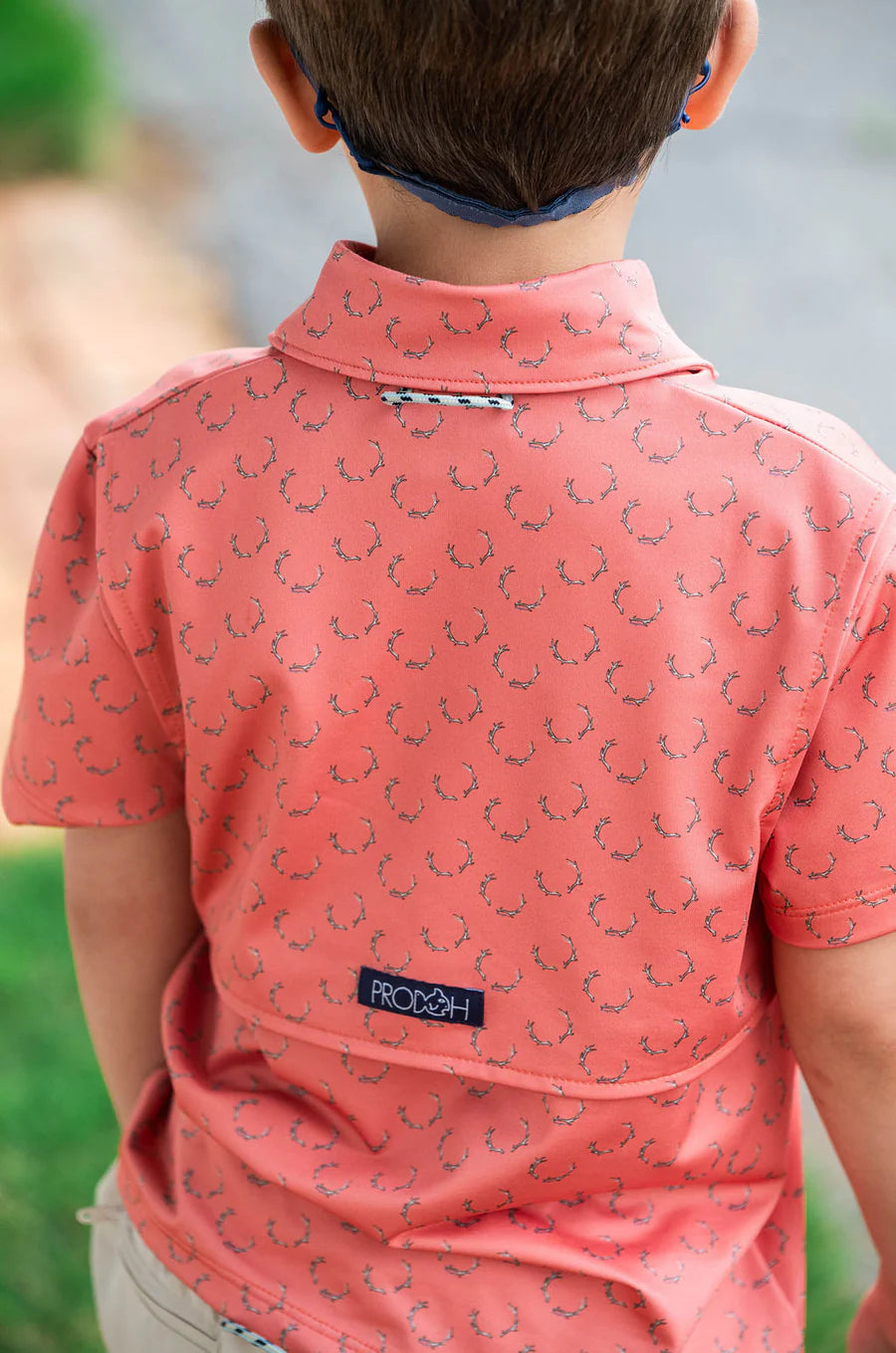 BOY'S SHORT SLEEVE PRO PERFORMANCE POLO IN DEER ANTLER PRINT ON ORANGE